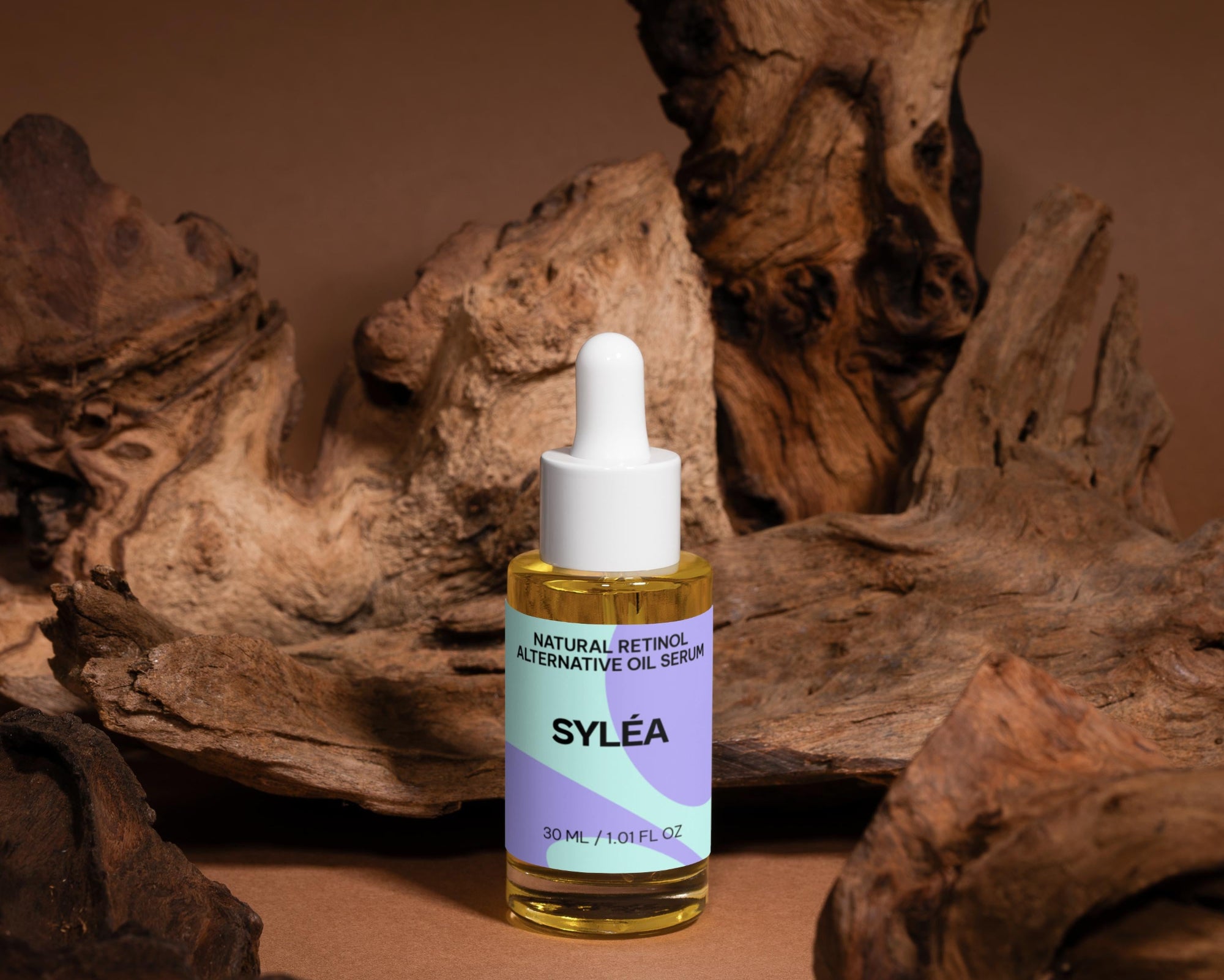 Syléa skincare dropper bottle on a brown background with natural wood elements